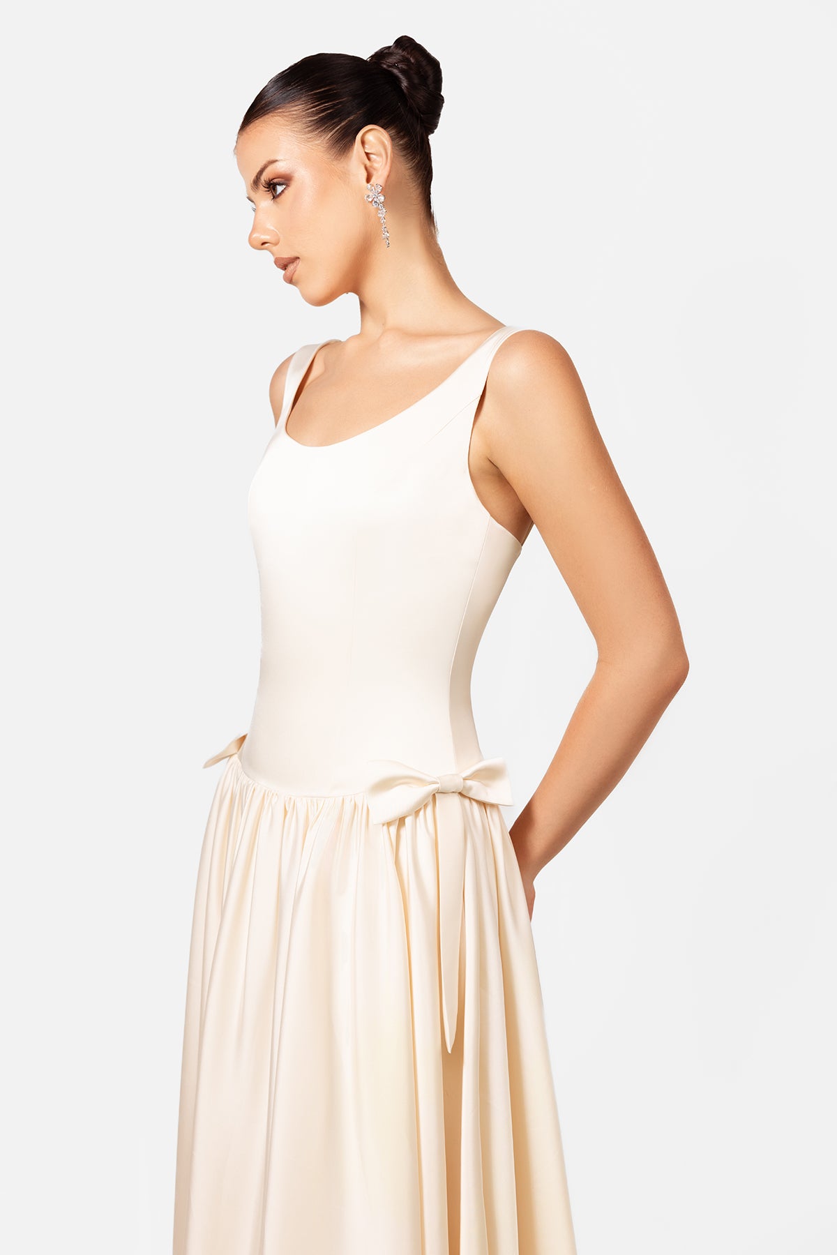 Ivory Sleeveless Maxi Dress with Gathered Waist and Flowing Skirt